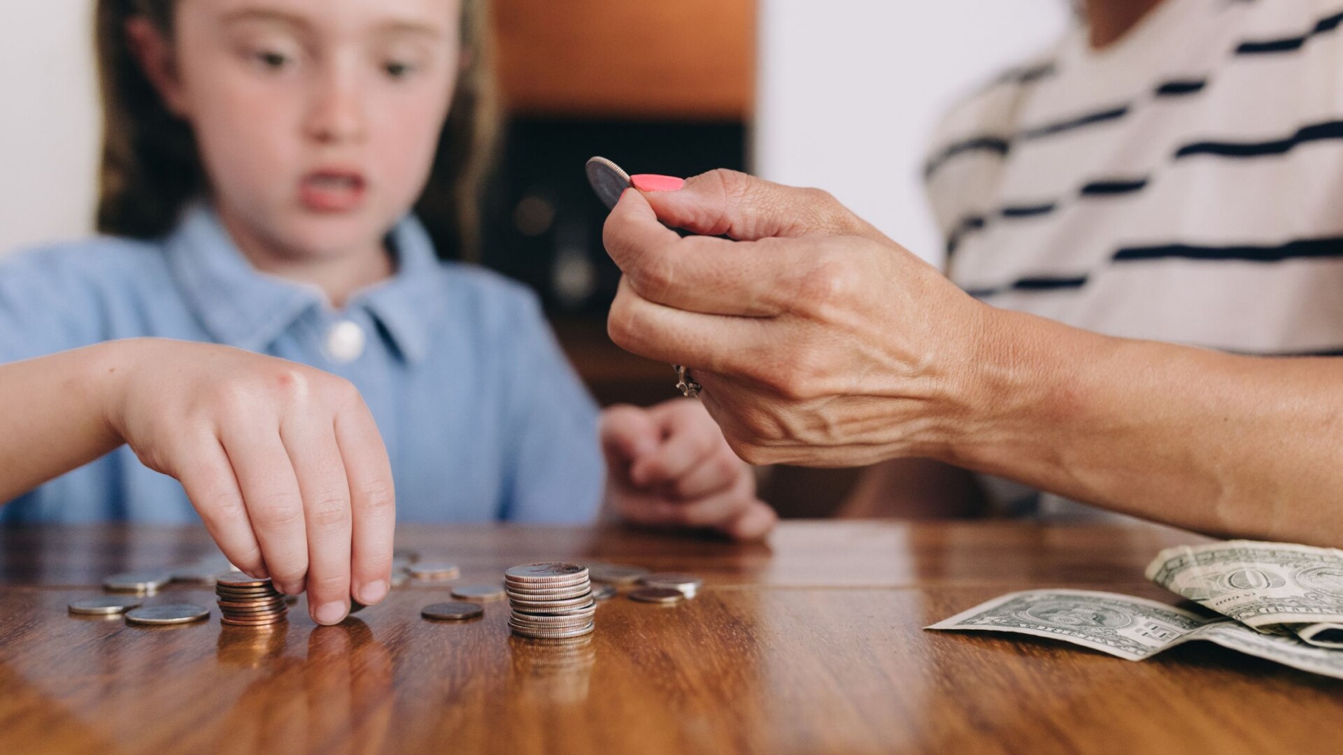 Grandparent and grandchild reviewing financial plans together while discussing Trump Accounts for future savings.